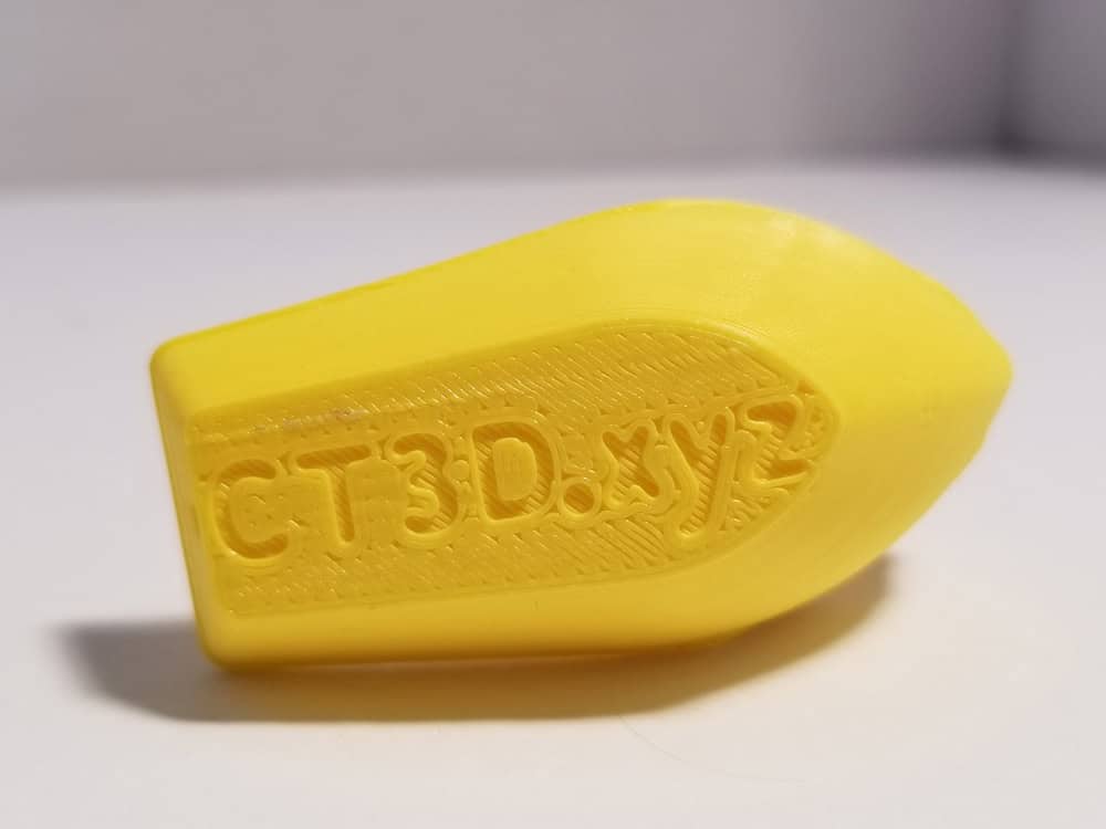 Yellow benchi tugboat bottom with letters.