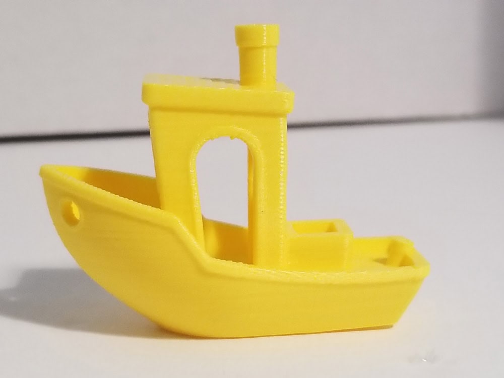 Photo: Yellow benchi tugboat with printer issues fixed. Side view.