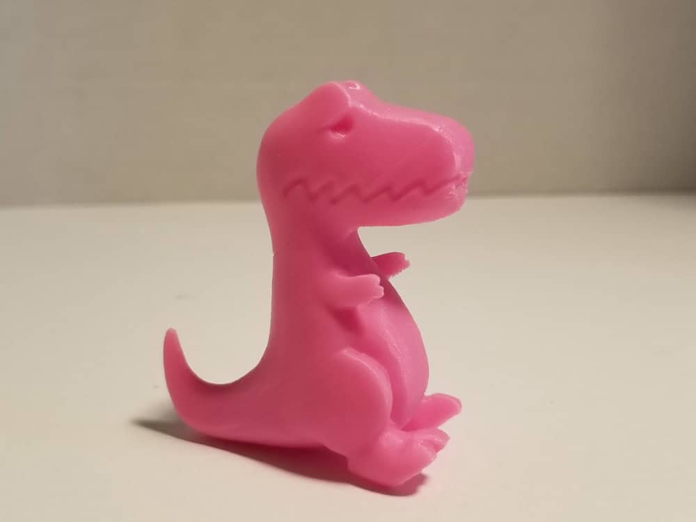Photo: Pink T-Rex 3D printout with printing issue fixed.