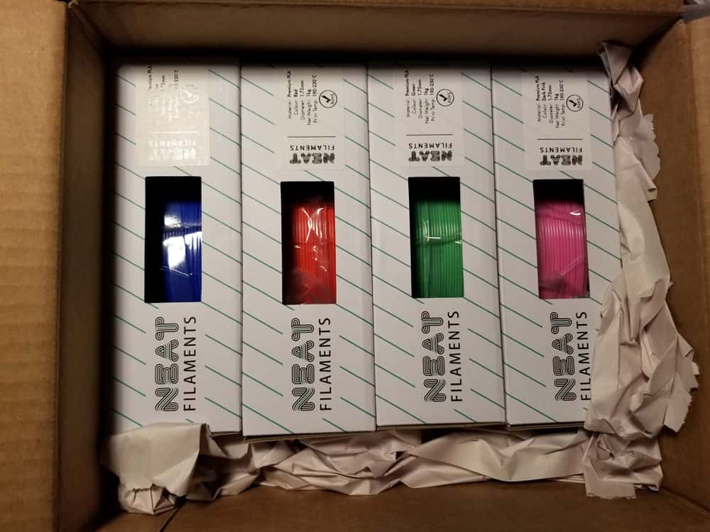 Neat PLA filaments - Blue, red, green, and pink.
