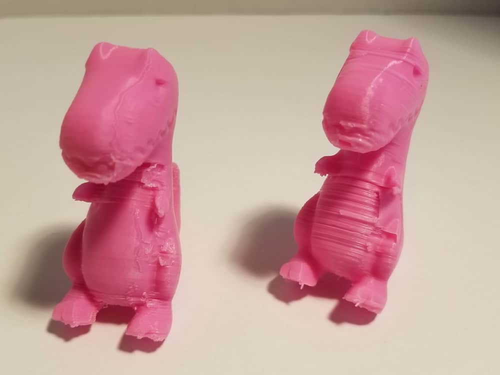 Photo of two pink Tyrannosaurus Rex.
