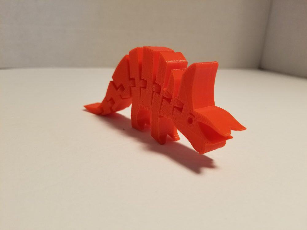 red triceratops - three quarters view.