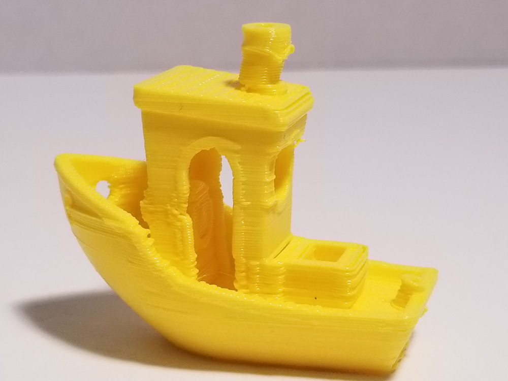 Yellow "Benchi" tugboat with printing issues.
