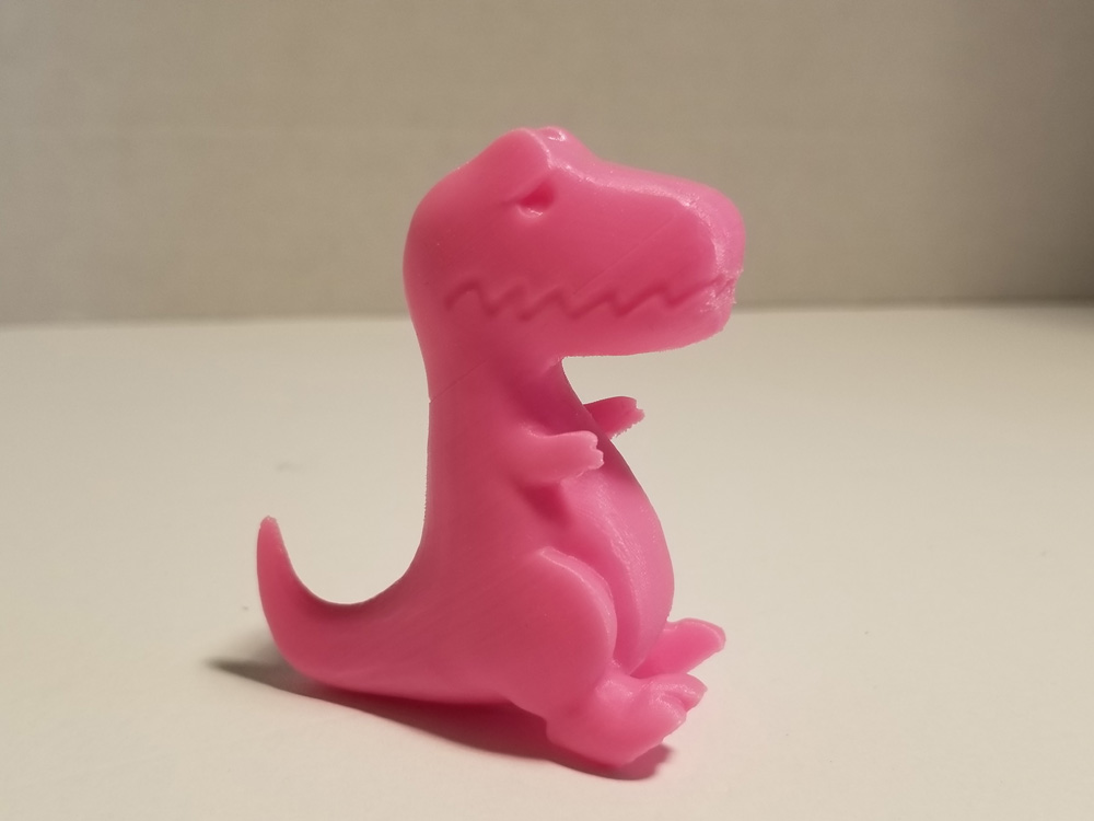 Photo: Pink T-Rex 3D printout with printing issue fixed.