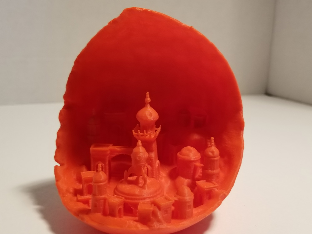Red 3d printout of Moon City from Thingiverse.com.
