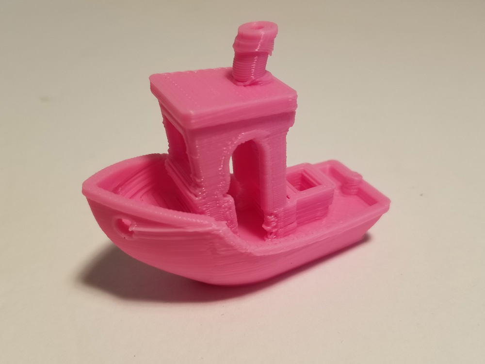 Pink "Benchi" tugboat with printing issues.