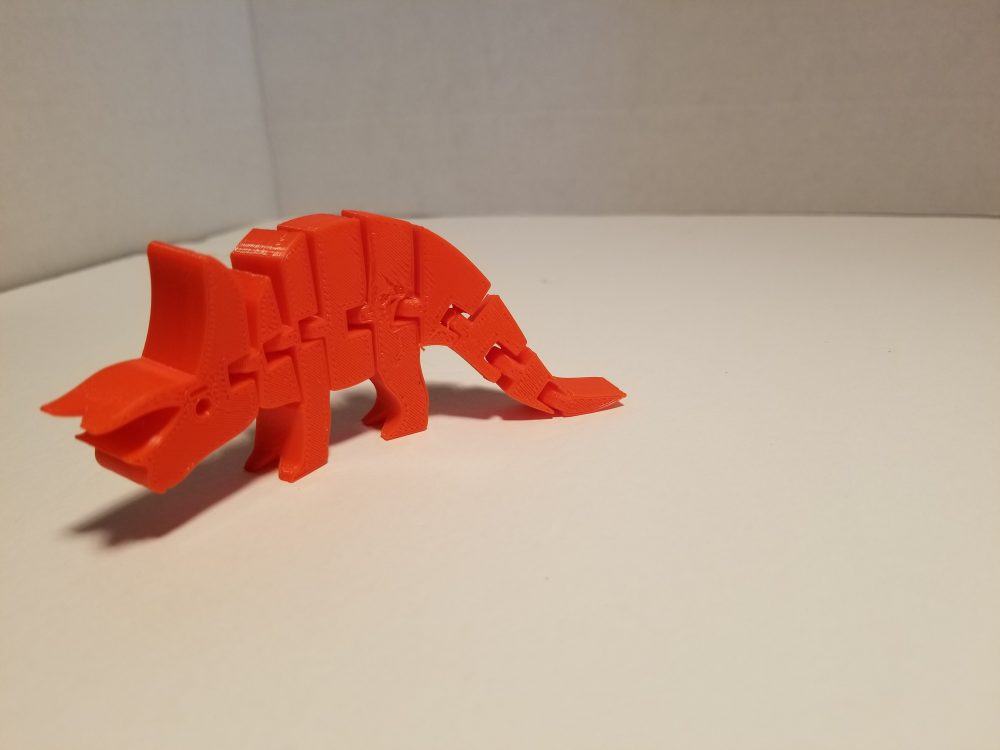 red articulated triceratops